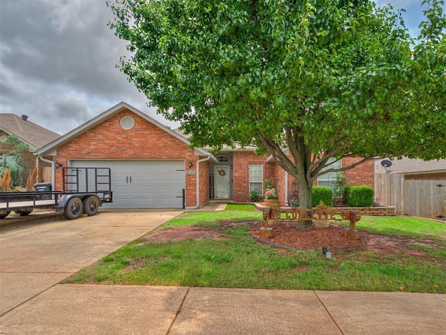 2120 NE 4th St, Moore, OK 73160 - view of front of house featuring brick siding, an attached garage, and concrete driveway