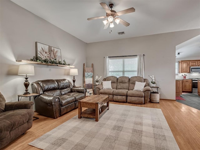 2120 NE 4th St, Moore, OK 73160 - living area featuring light wood-style flooring and a ceiling fan