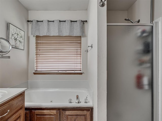 2120 NE 4th St, Moore, OK 73160 - full bathroom featuring a stall shower, vanity, and a tub with jets