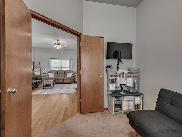 2120 NE 4th St, Moore, OK 73160 - living area featuring a ceiling fan and light wood-style floors