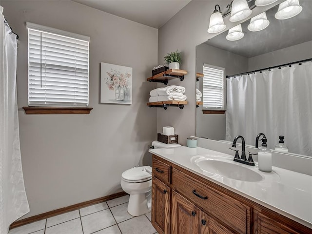 2120 NE 4th St, Moore, OK 73160 - full bathroom with toilet, vanity, tile patterned flooring, and baseboards