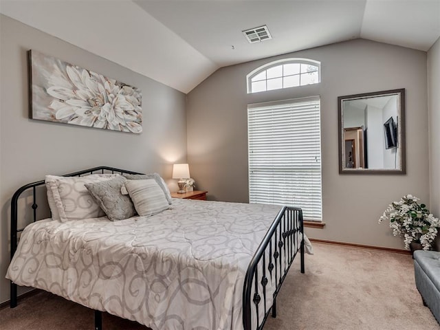 2120 NE 4th St, Moore, OK 73160 - bedroom with vaulted ceiling, carpet floors, and baseboards