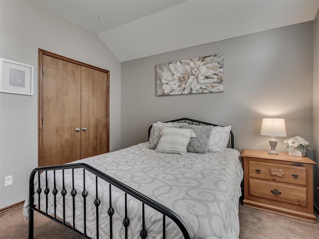 2120 NE 4th St, Moore, OK 73160 - bedroom featuring light carpet, a closet, and vaulted ceiling