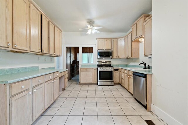 624 N Wentz St, Guthrie, OK 73044 - kitchen with stainless steel appliances, light brown cabinets, ceiling fan, light countertops, and light tile patterned floors
