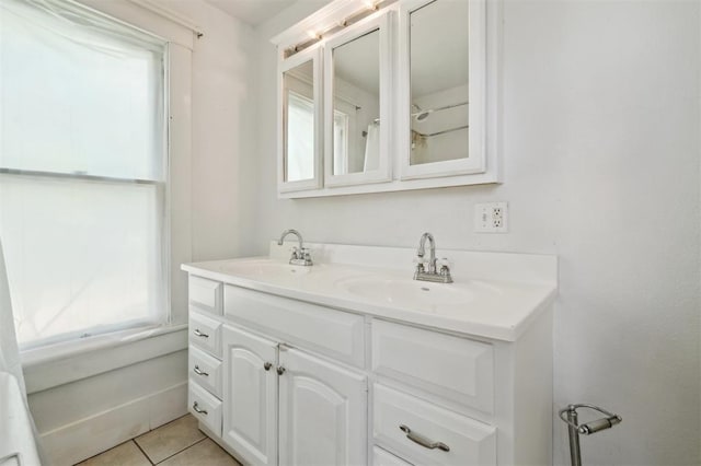 624 N Wentz St, Guthrie, OK 73044 - bathroom with double vanity, healthy amount of natural light, and tile patterned floors