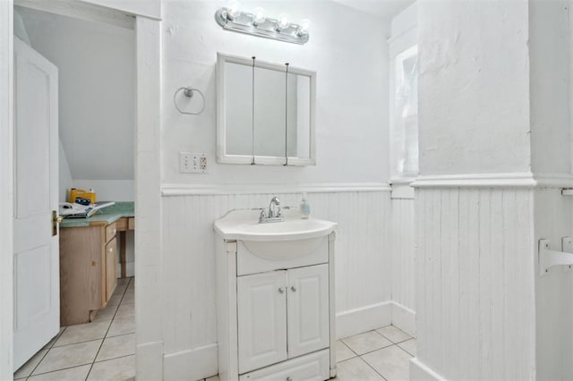 624 N Wentz St, Guthrie, OK 73044 - bathroom with tile patterned floors, vanity, and a wainscoted wall