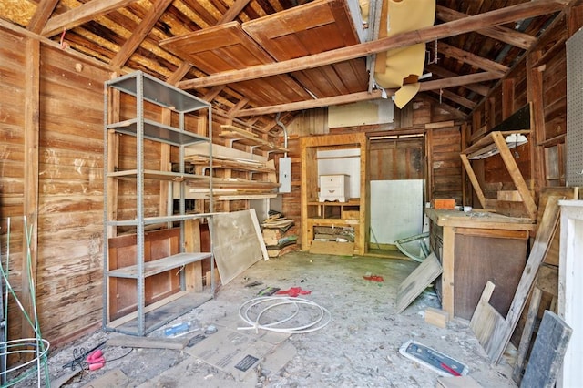 624 N Wentz St, Guthrie, OK 73044 - miscellaneous room featuring lofted ceiling, electric panel, and wooden walls