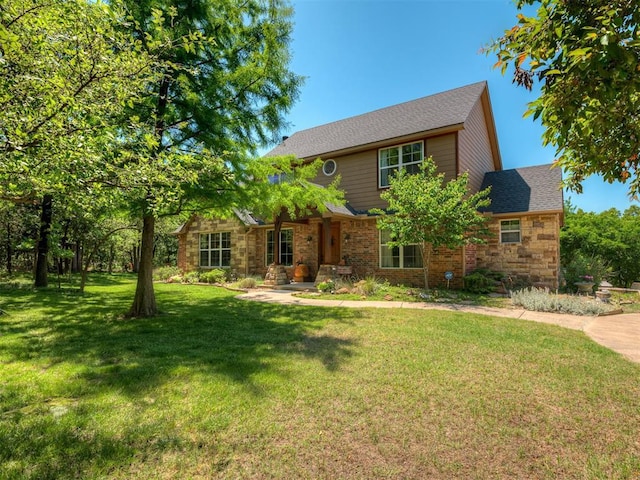 19401 N Peebly Rd, Luther, OK 73054 - traditional home featuring a front yard and stone siding