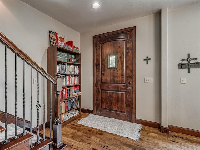 19401 N Peebly Rd, Luther, OK 73054 - entryway featuring wood finished floors, stairway, and baseboards