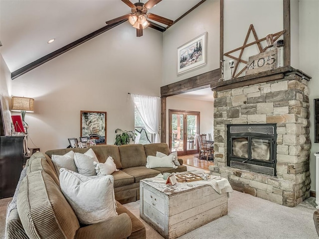 19401 N Peebly Rd, Luther, OK 73054 - living area featuring high vaulted ceiling, ceiling fan, carpet, french doors, and a stone fireplace