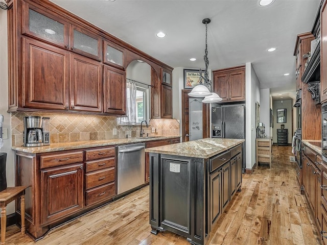 19401 N Peebly Rd, Luther, OK 73054 - kitchen with dishwasher, light wood-style floors, hanging light fixtures, recessed lighting, and backsplash