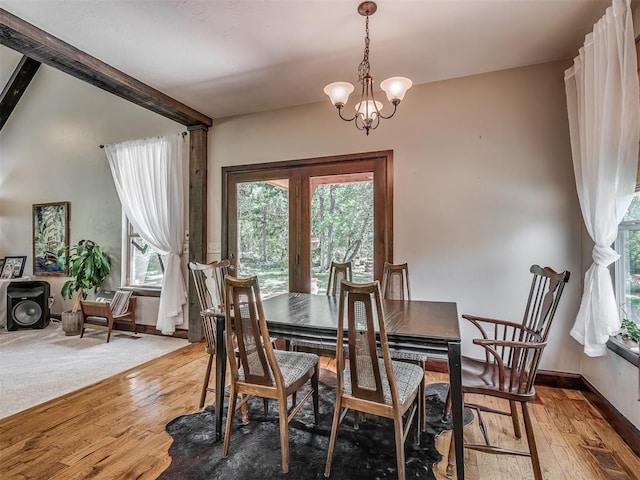 19401 N Peebly Rd, Luther, OK 73054 - dining space featuring plenty of natural light, hardwood / wood-style flooring, beamed ceiling, a chandelier, and baseboards