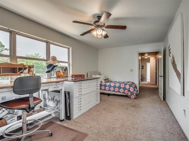 19401 N Peebly Rd, Luther, OK 73054 - bedroom with light colored carpet, a ceiling fan, and an office area
