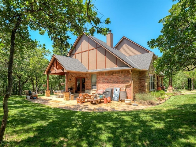 19401 N Peebly Rd, Luther, OK 73054 - back of property with a chimney, brick siding, a yard, and roof with shingles