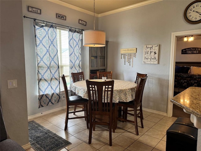 1912 SE 18th St, Moore, OK 73160 - dining room with light tile patterned floors, crown molding, and baseboards