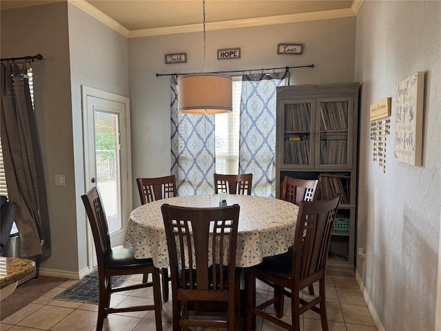1912 SE 18th St, Moore, OK 73160 - dining area featuring light tile patterned flooring, crown molding, and baseboards
