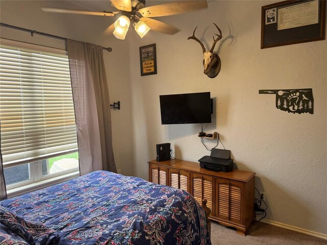 1912 SE 18th St, Moore, OK 73160 - carpeted bedroom with baseboards and a ceiling fan