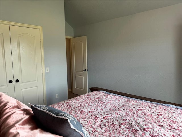 1912 SE 18th St, Moore, OK 73160 - bedroom with a closet, vaulted ceiling, and baseboards