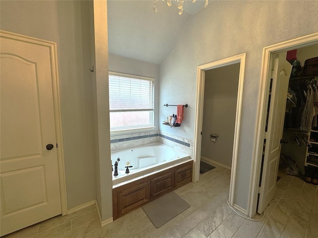 1912 SE 18th St, Moore, OK 73160 - full bathroom featuring lofted ceiling, a bath, and a walk in closet