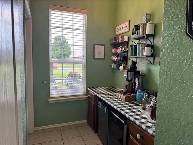 1912 SE 18th St, Moore, OK 73160 - kitchen with wine cooler, light tile patterned floors, and baseboards