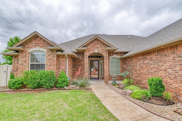 5524 SE 57th St, Oklahoma City, OK 73135 - view of front of property featuring roof with shingles and brick siding