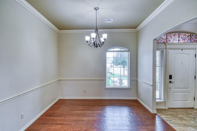 5524 SE 57th St, Oklahoma City, OK 73135 - foyer featuring a chandelier, hardwood / wood-style flooring, ornamental molding, and baseboards