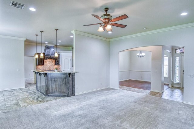 5524 SE 57th St, Oklahoma City, OK 73135 - unfurnished living room with ceiling fan, crown molding, arched walkways, recessed lighting, and light carpet