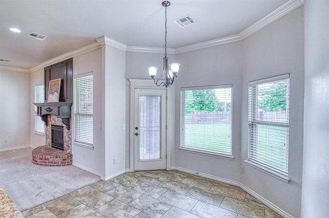 5524 SE 57th St, Oklahoma City, OK 73135 - unfurnished dining area featuring crown molding, a chandelier, healthy amount of natural light, a fireplace, and baseboards