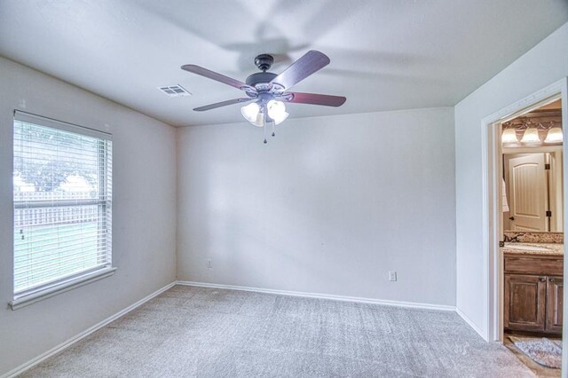 5524 SE 57th St, Oklahoma City, OK 73135 - unfurnished room with ceiling fan, light colored carpet, a sink, and baseboards