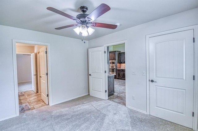 5524 SE 57th St, Oklahoma City, OK 73135 - unfurnished bedroom with light colored carpet, baseboards, and ceiling fan