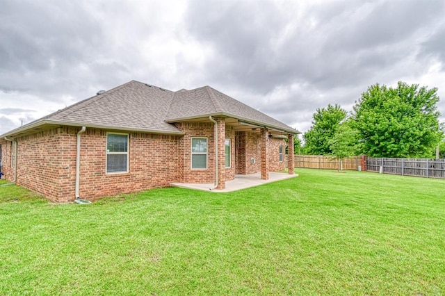 5524 SE 57th St, Oklahoma City, OK 73135 - rear view of property featuring a patio area, brick siding, and a shingled roof