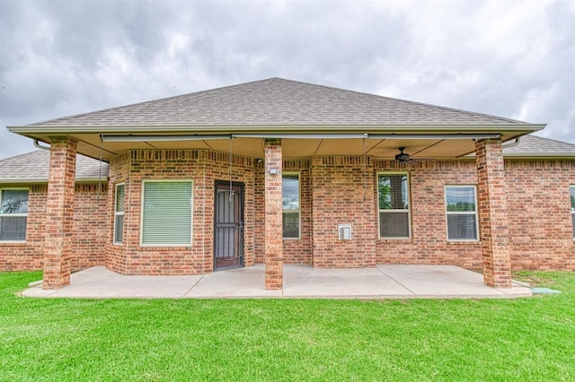 5524 SE 57th St, Oklahoma City, OK 73135 - rear view of property featuring brick siding, a shingled roof, a yard, and a patio area