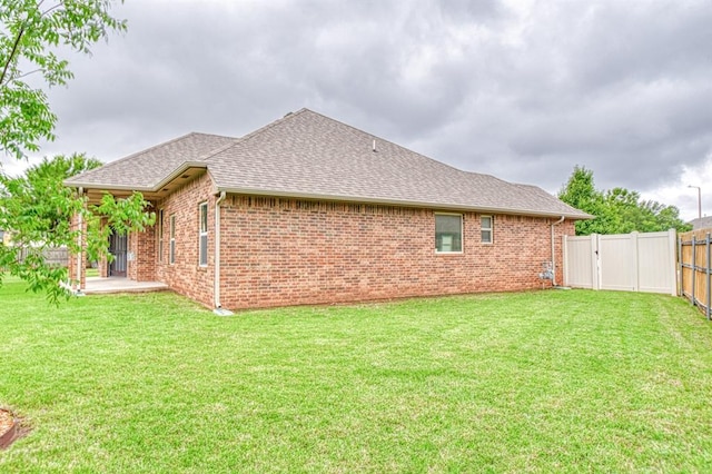 5524 SE 57th St, Oklahoma City, OK 73135 - view of home's exterior featuring a shingled roof and brick siding