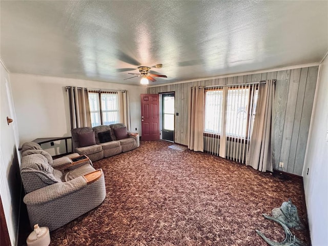 4443 Apperson Rd, Burbank, OK 74633 - carpeted living area with ceiling fan and a textured ceiling