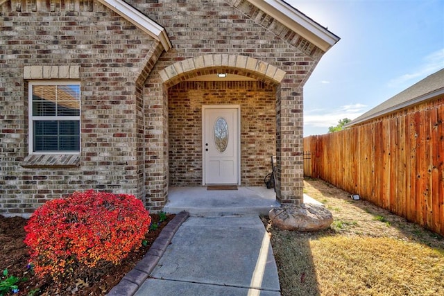 19009 Meadows Crossing Dr, Edmond, OK 73012 - doorway to property with brick siding