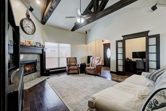 19009 Meadows Crossing Dr, Edmond, OK 73012 - living room featuring beamed ceiling, high vaulted ceiling, a high end fireplace, a ceiling fan, and wood-type flooring