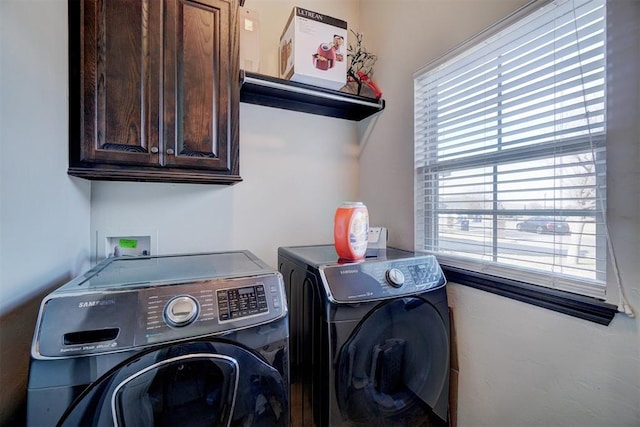 19009 Meadows Crossing Dr, Edmond, OK 73012 - laundry area with washer and dryer, cabinet space, and plenty of natural light