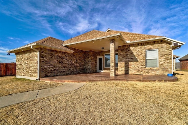 19009 Meadows Crossing Dr, Edmond, OK 73012 - view of front of property featuring a patio area, brick siding, and roof with shingles