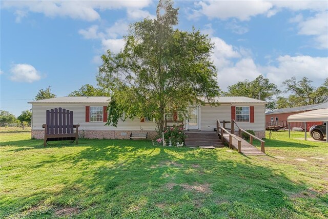 1020 S Walnut Ave, Erick, OK 73645 - back of house featuring a yard and metal roof