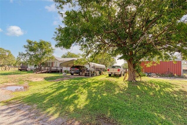 1020 S Walnut Ave, Erick, OK 73645 - view of grassy yard featuring a carport