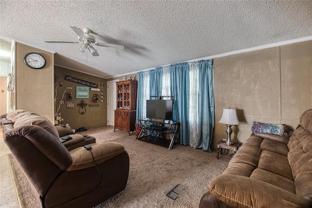 1020 S Walnut Ave, Erick, OK 73645 - carpeted living room featuring ceiling fan, crown molding, and a textured ceiling