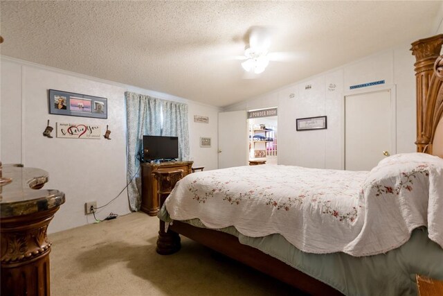 1020 S Walnut Ave, Erick, OK 73645 - carpeted bedroom featuring vaulted ceiling, a textured ceiling, and a ceiling fan