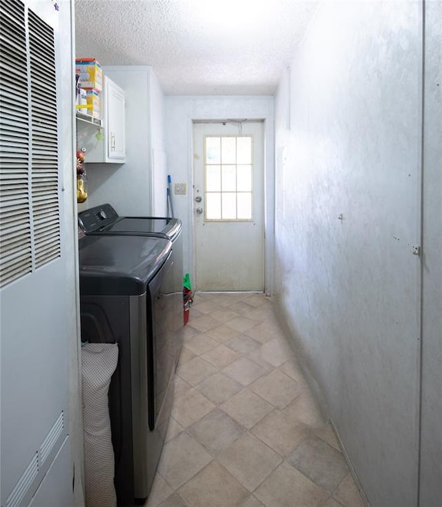 1020 S Walnut Ave, Erick, OK 73645 - laundry room with cabinet space, a heating unit, separate washer and dryer, and a textured ceiling