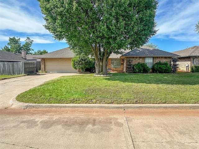 5821 NW 89th St, Oklahoma City, OK 73132 - view of front of house featuring concrete driveway, a garage, and brick siding
