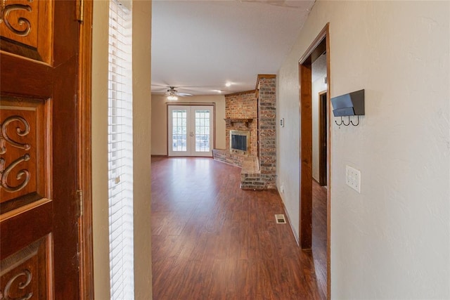5821 NW 89th St, Oklahoma City, OK 73132 - hallway with dark wood finished floors, french doors, and baseboards