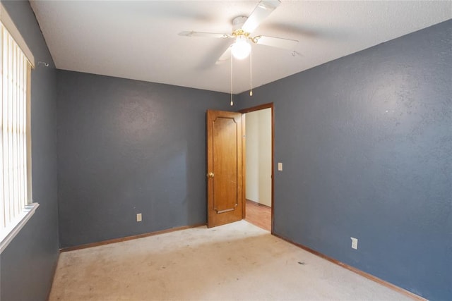 5821 NW 89th St, Oklahoma City, OK 73132 - carpeted spare room featuring a ceiling fan and baseboards