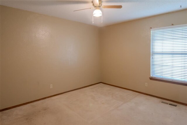 5821 NW 89th St, Oklahoma City, OK 73132 - unfurnished room with ceiling fan, light colored carpet, and baseboards