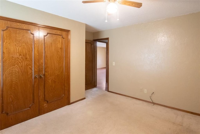 5821 NW 89th St, Oklahoma City, OK 73132 - unfurnished bedroom featuring light colored carpet, baseboards, a ceiling fan, and a closet