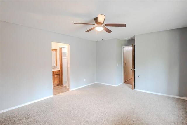 5821 NW 89th St, Oklahoma City, OK 73132 - spare room featuring ceiling fan, light carpet, and baseboards