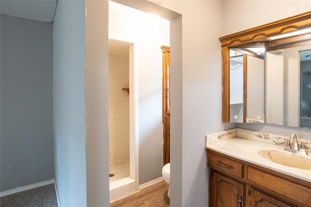 5821 NW 89th St, Oklahoma City, OK 73132 - full bathroom with toilet, a stall shower, vanity, and wood finished floors
